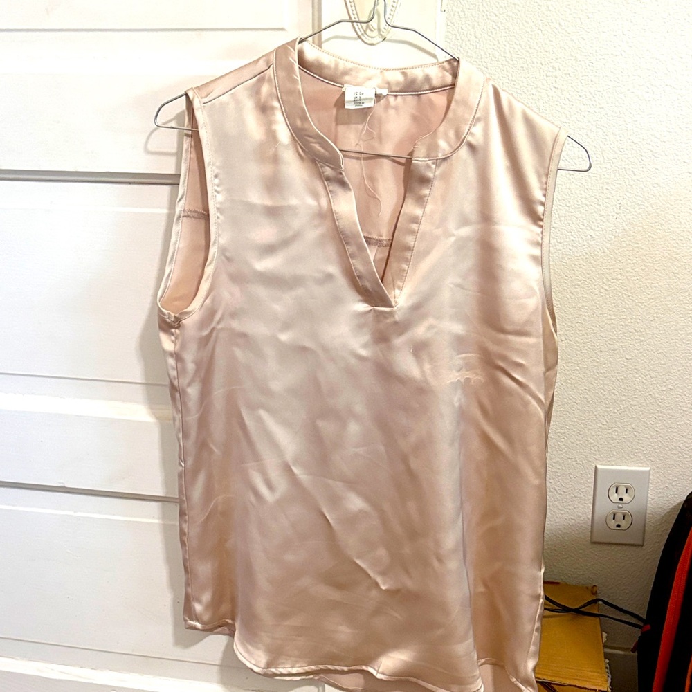 Woman’s champagne color shirt, size small.